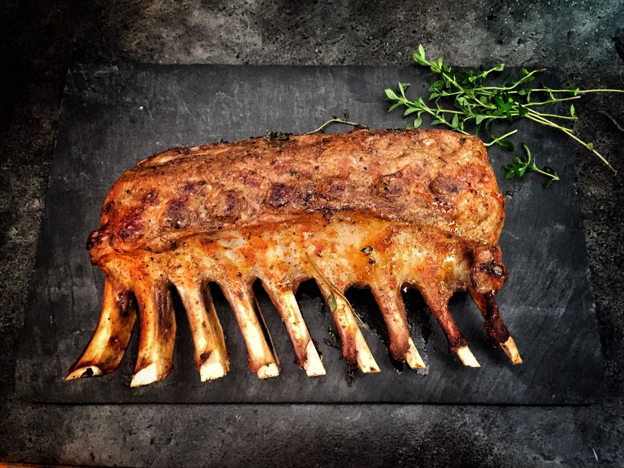 Hand-cut steaks on a butcher block